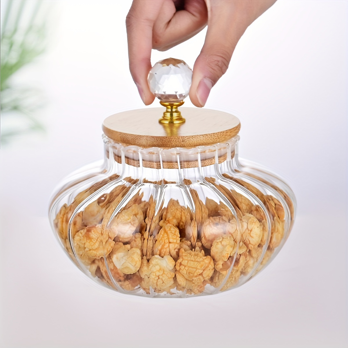 A Glass Jar With A Lid For Storing Food In